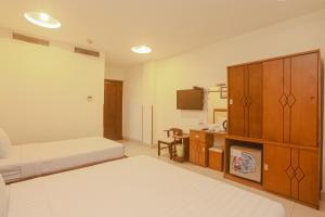 Postel nebo postele na pokoji v ubytování Song Anh 3 Hotel