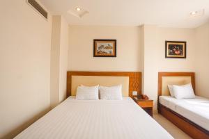 Postel nebo postele na pokoji v ubytování Song Anh 3 Hotel