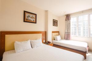 Postel nebo postele na pokoji v ubytování Song Anh 3 Hotel