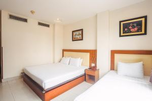 Postel nebo postele na pokoji v ubytování Song Anh 3 Hotel