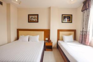 Postel nebo postele na pokoji v ubytování Song Anh 3 Hotel