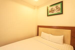 Postel nebo postele na pokoji v ubytování Song Anh 3 Hotel
