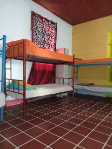 a dorm room with two bunk beds in it at Karim Hostel in Guatemala