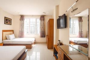 Postel nebo postele na pokoji v ubytování Song Anh 3 Hotel