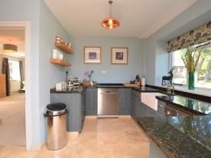 a kitchen with gray cabinets and a counter top at 3 Bed in Tansley 57013 in Tansley