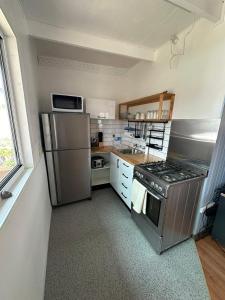 A kitchen or kitchenette at By the Bay Beach Shack