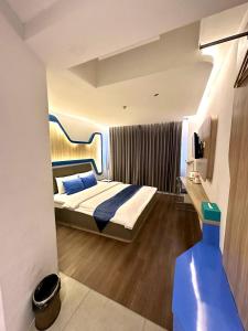 Tempat tidur dalam kamar di Golden Palace Hotel