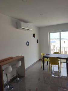 a dining room with a table and chairs at Sorriso Flat n.9 - Entire Unit in St. Paul's Bay