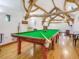 a pool table in a room with beams at 4 Bed in Routenbeck SZ405 in Bassenthwaite Lake