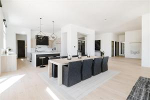 a kitchen and living room with a table and chairs at Sundown Scottsdale in Scottsdale