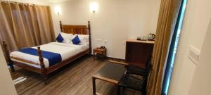 COASTAL GRAND RESORT - KOTAGIRI客房内的一张或多张床位
