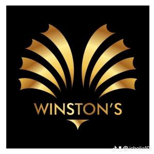 OnitshaにあるWinstons Place Hotelの黒地の黄黒のロゴ
