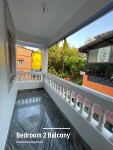 a balcony of a house with a water feature at Sai Homestay Goa - Margao in Madgaon
