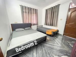 a bedroom with two beds in a room at Sai Homestay Goa - Margao in Madgaon