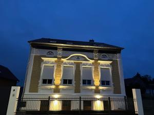 a building with lights on the side of it at Villa Schellhase in Werder