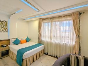 Postel nebo postele na pokoji v ubytování Melili Hotel + 37 fotografií
