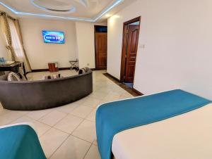 TV a/nebo společenská místnost v ubytování Melili Hotel