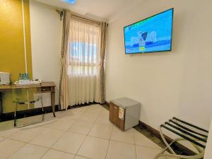 TV a/nebo společenská místnost v ubytování Melili Hotel