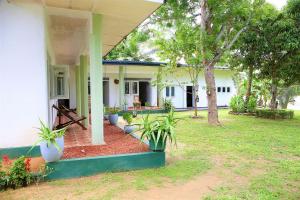 a house with plants on the front of it at riVer in Pelena