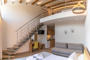a living room with a staircase and a dining room at IL Mare Plataria in Igoumenitsa