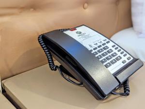 a phone sitting on top of a table at Melili Hotel in Nairobi