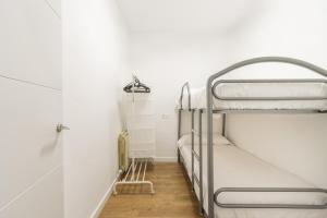 a group of bunk beds in a room at Casa Olegari 