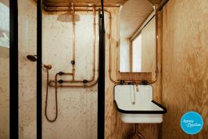 a bathroom with a toilet and a sink at Ecolodge Acm Vue Lac Et Bain Nordique in Rovagny