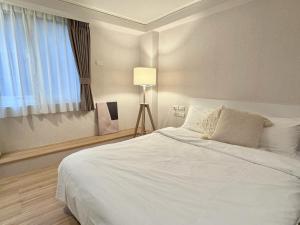 Letto o letti in una camera di Meworld Hotel - Zhongshan
