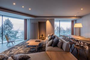 a living room with a couch and a table at MUWA NISEKO in Kutchan
