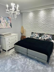 Posteľ alebo postele v izbe v ubytovaní Rynek Apartament