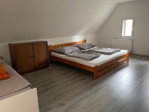 A bed or beds in a room at Chata Kunvald