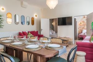 a dining room with a table and chairs at Sophie Stay - Le Mucha - King size bed - AC in Paris