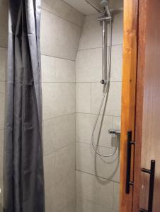 a bathroom with a shower with a shower curtain at Mps Holland in Amsterdam