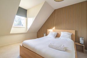 เตียงในห้องที่ Santa Monica, maison individuelle, 6ch, parking