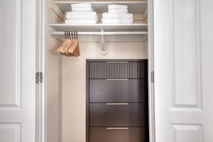 a walk in closet with a black door and towels at Nolita 1BR w Elevator Roof Deck nr SoHo NYC-907 in New York