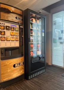 a vending machine with food inside of it at Hotel Premium in Forbach