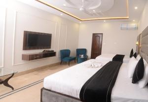Voodi või voodid majutusasutuse Hotel Five Season Lahore toas