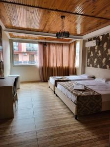 Postel nebo postele na pokoji v ubytování Hotel Elio