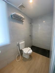 Ένα μπάνιο στο Swasana Hotel Medan