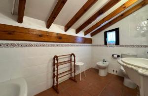 a bathroom with a sink and a toilet at Posada Rio Cubas in Cubas +68 photos