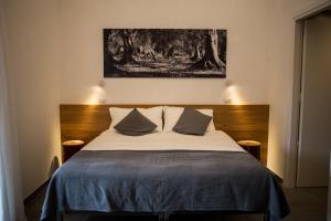 מיטה או מיטות בחדר ב-Bio Agriturismo Corte degli Ulivi