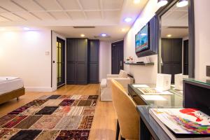 TV a/nebo společenská místnost v ubytování Antusa Design Hotel & Spa