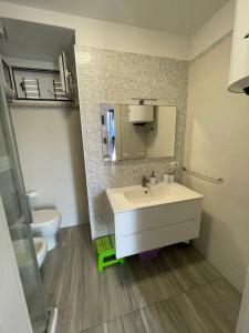 a bathroom with a sink and a toilet at Specchio Marino in Ponza