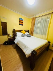 Un ou plusieurs lits dans un hébergement de l'établissement Lovely 2 Bedroom Apartment in Ongata Rongai