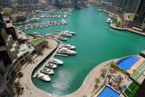 an aerial view of a marina with boats in the water at Panoramic Marina View 2BR Suite Damac Heights in Dubai
