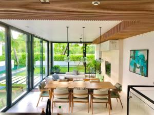 a dining room with a table and chairs at 3 bedroom Villa with private pool on the west coast of Phu Quoc in Phu Quoc