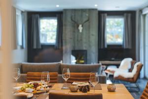 a dining room with a table with wine glasses at Le Brocard in Durbuy +20 photos