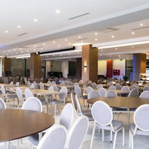 an empty cafeteria with tables and chairs at Karpalas City Hotel & Spa in Bolu