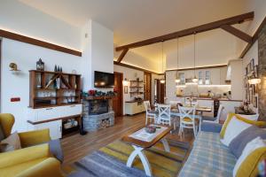 a living room with a couch and a table at Mountain villa Jordan- with JACUZZI in Razlog