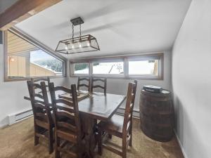 a dining room with a wooden table and chairs at VP211 Village Point condo in Copper Mountain